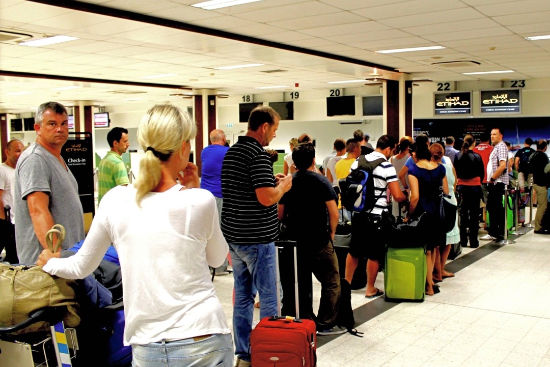 Passengers queue for check-in at Ibrahim Nasir International Airport